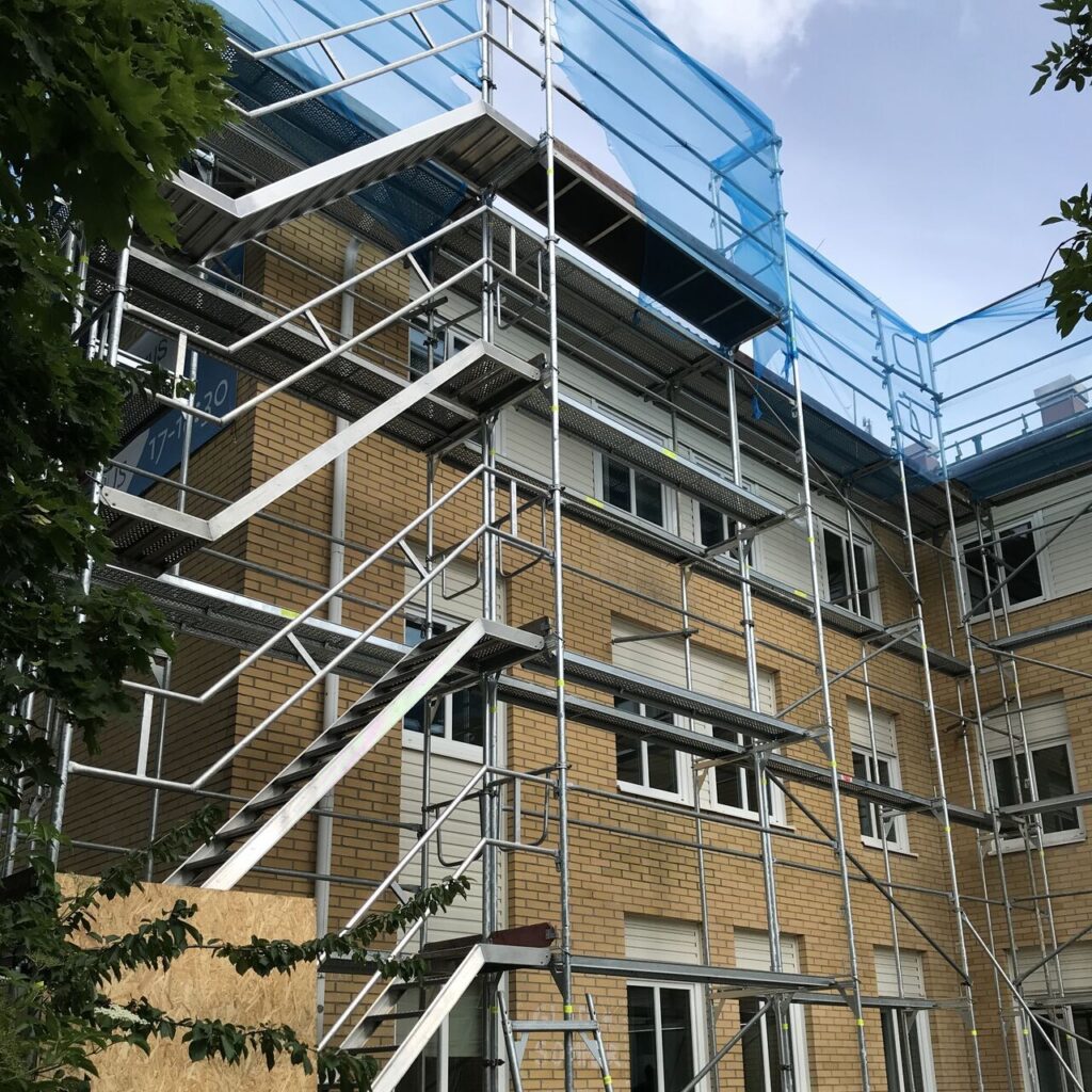 Facade scaffolding EURO+ and a staircase for house renovation