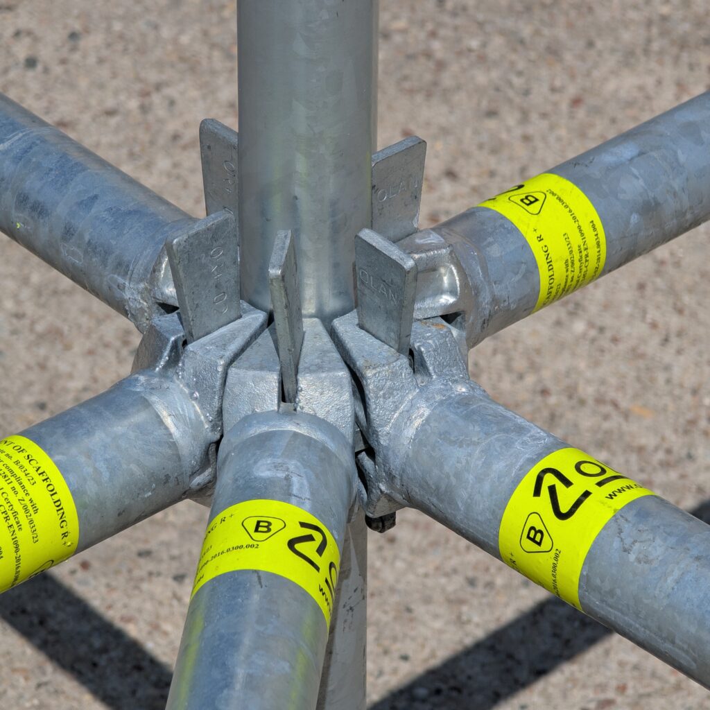 Ledgers attached to the standard of OLAN R+ modular scaffolding